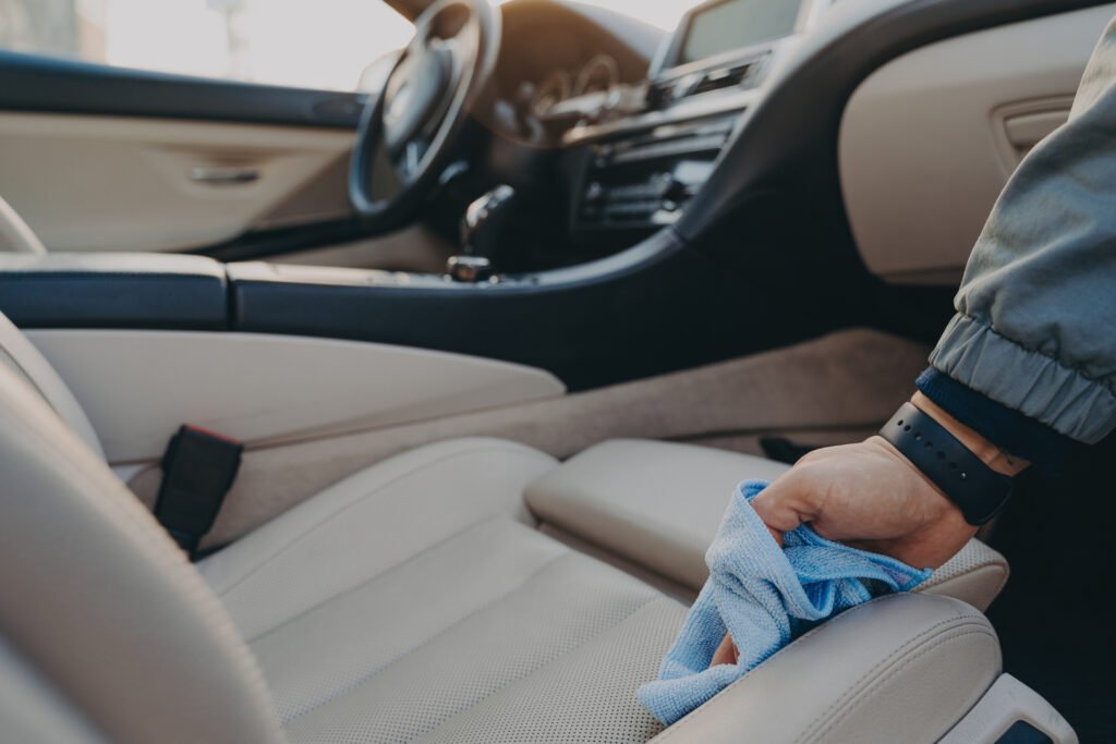 medium vecteezy man cleaning car interior with microfiber cloth at carwash 11277792 medium