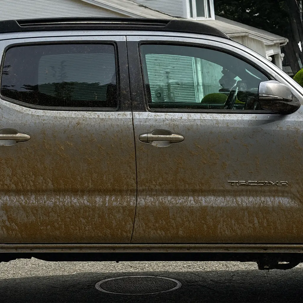 Toyota Tacoma before auto detailing in [tmc_town] MA with mud on doors
