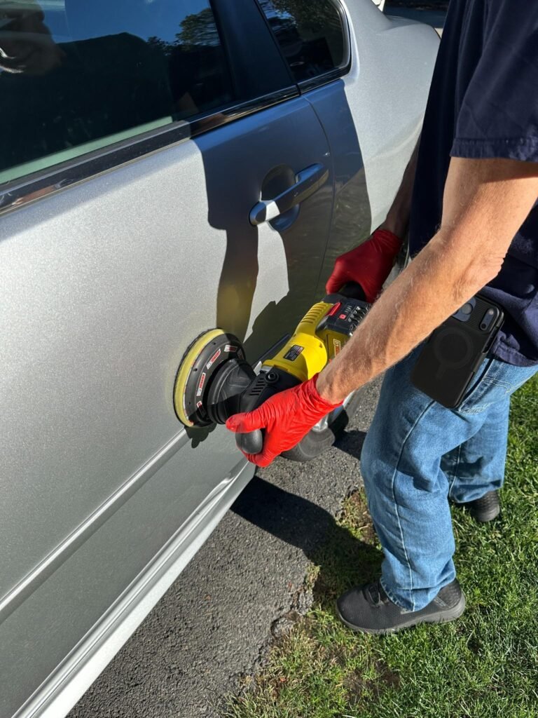 Chevy Impala Transformation (Part 2): Polishing & Paint Correction 6 Machine polishing a Chevy Impala panel to restore clarity and shine