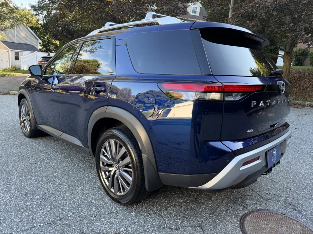 Blue Nissan Pathfinder after ceramic coating showing deep gloss and reflections